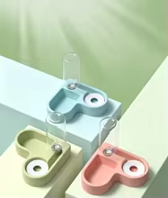 Automatic pet food and water bowl shown in multiple color options