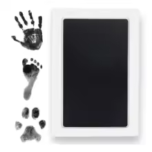 Cat paw being gently pressed onto an inkless paw print keepsake pad